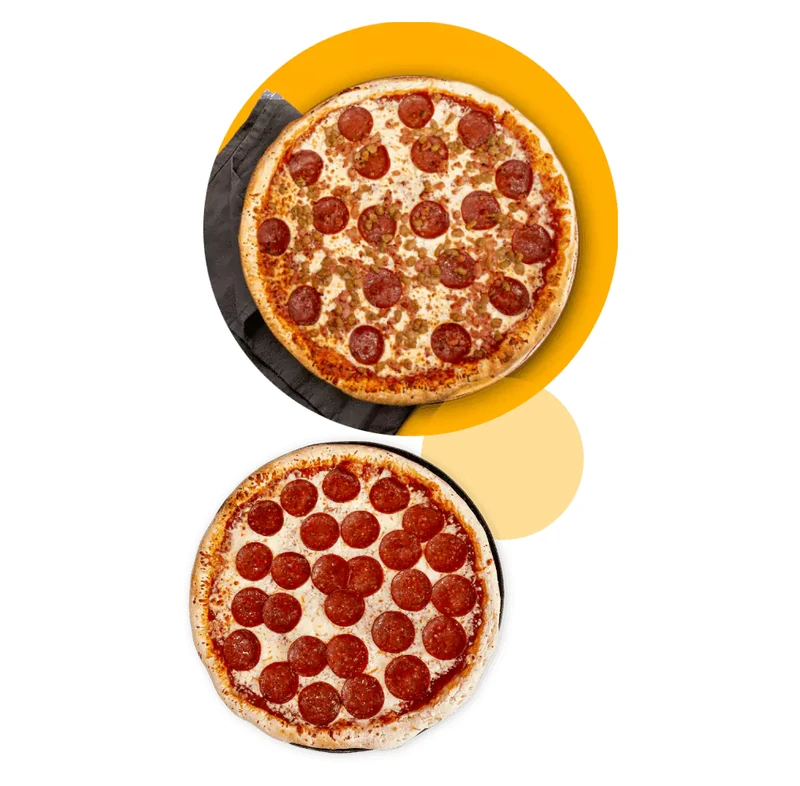 Pepperoni pizzas fresh from the oven at Queen's Pizza & Wings in Hamilton, ON